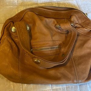 Light brown leather handbag.